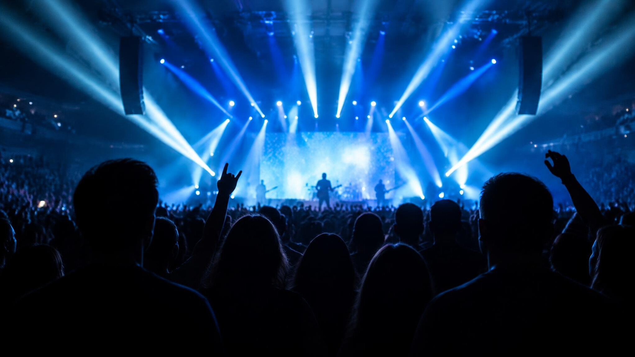 Large event crowd under stage lights