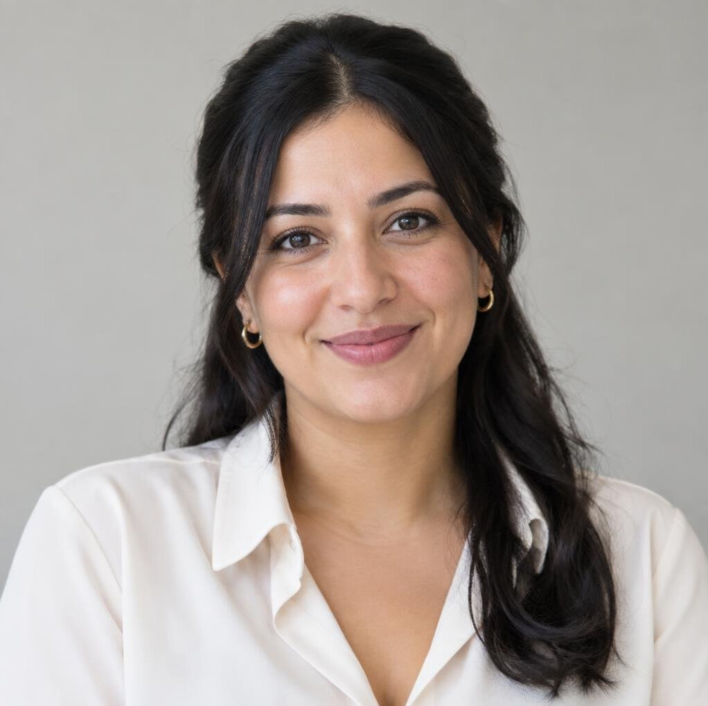 Portrait of a woman with dark hair smiling